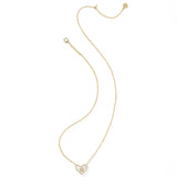 Gold necklace with a heart-shaped pendant on a white background