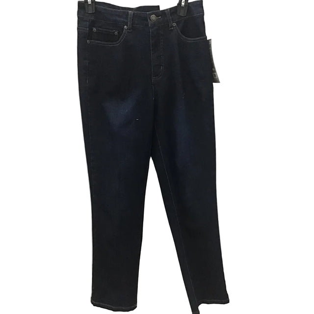 Dark wash blue jeans hanging on a hanger against a white paneled wall with patterned lace curtains on both sides.
