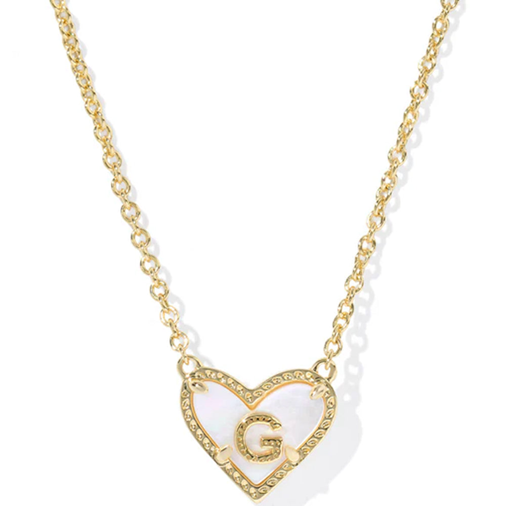 Gold necklace with a heart-shaped pendant featuring the letter 'G' on a white background