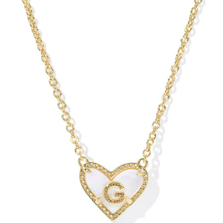 Gold necklace with a heart-shaped pendant featuring the letter 'G' on a white background