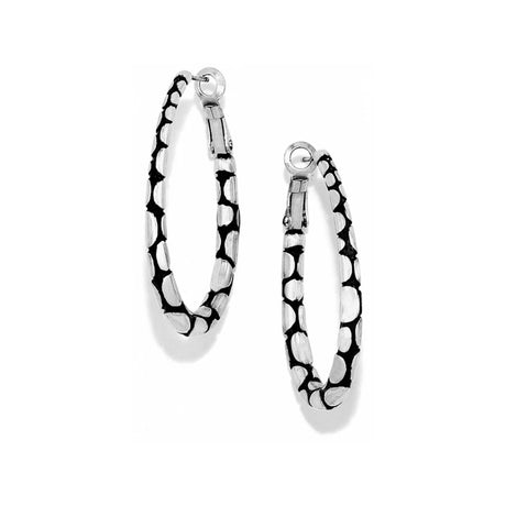Pair of silver hoop earrings with black pattern on a white background