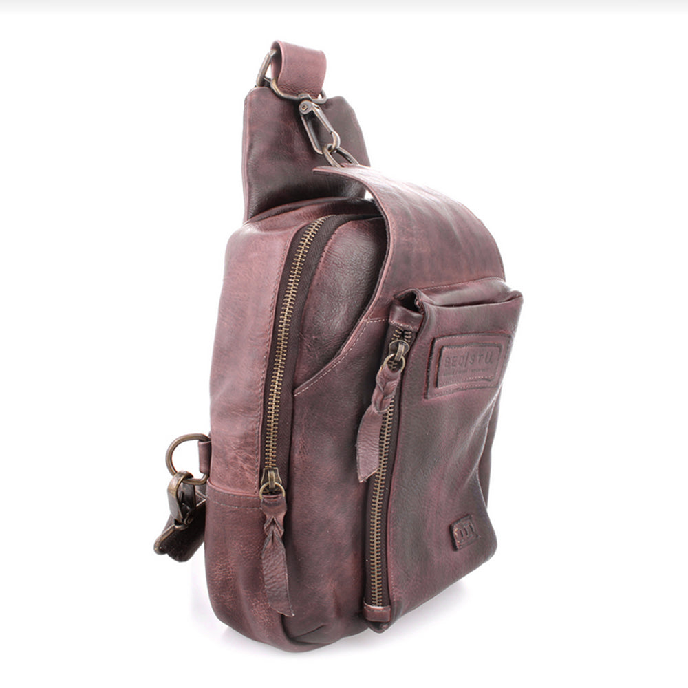Brown leather sling bag on a white background