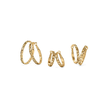 Set of gold hoop earrings on a white background