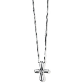 Silver cross pendant on a chain against a white background
