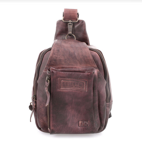 Brown leather sling bag with visible brand logo on a white background