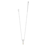 Silver necklace with a triangle pendant on a white background