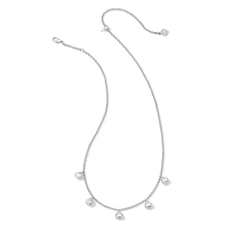 Silver necklace with pearl-like pendants on a white background