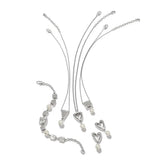 Silver jewelry set with necklaces and heart-shaped pendants on a white background