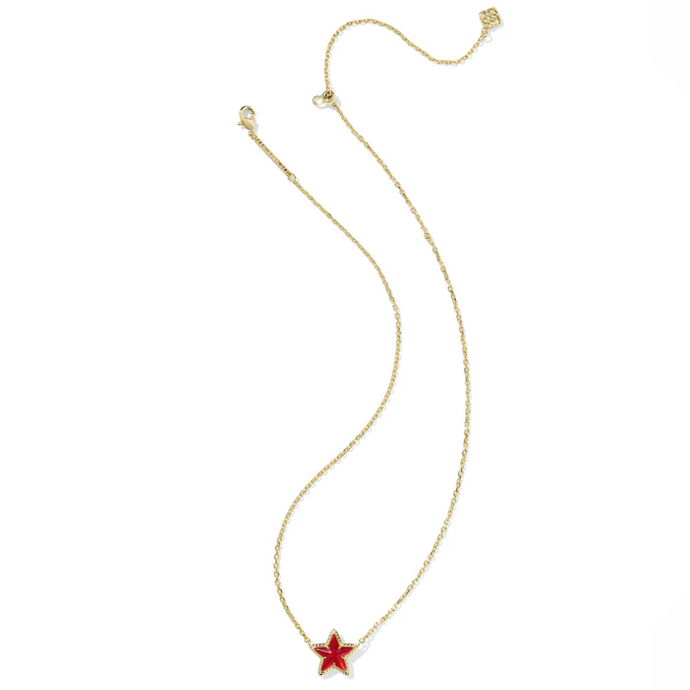 Gold necklace with a red star pendant on a white background