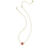Gold necklace with a red star pendant on a white background