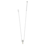 Silver necklace with a small pendant on a white background