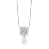 Silver necklace with a square pendant and pearl drop on a white background