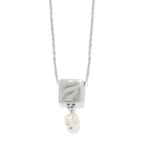 Silver necklace with a square pendant and pearl drop on a white background