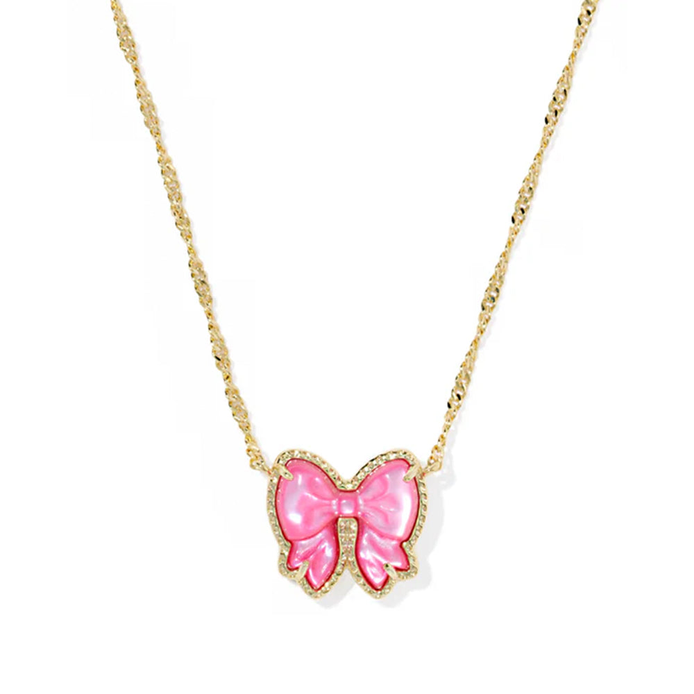 Necklace with a pink bow pendant on a gold chain against a white background