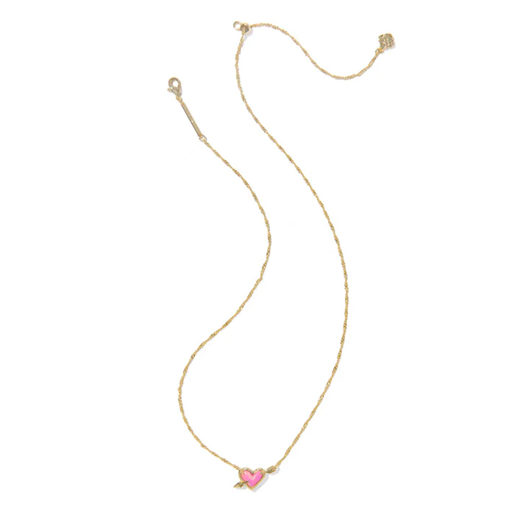 Gold necklace with a pink heart pendant on a white background
