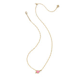 Gold necklace with a pink heart pendant on a white background