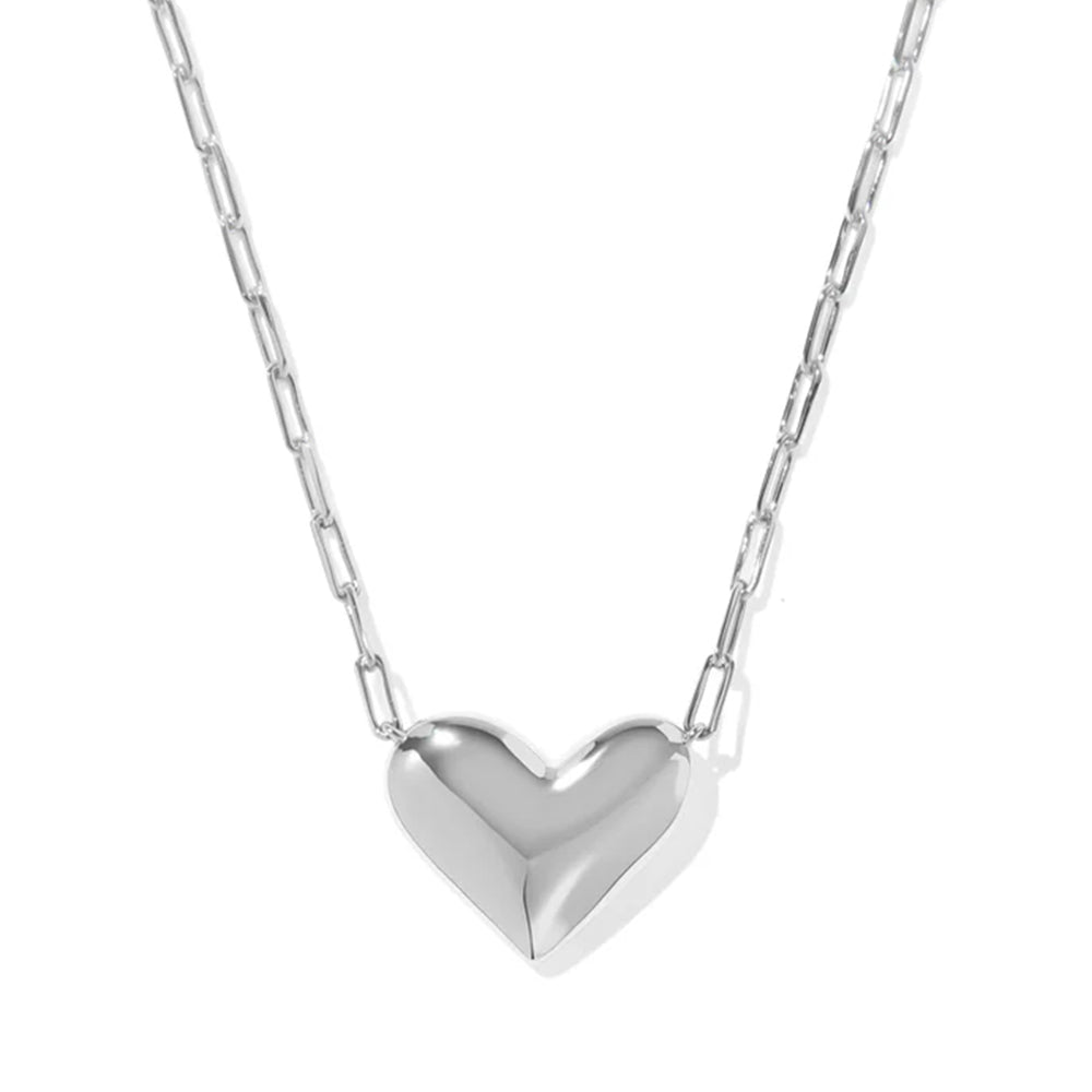 Silver heart-shaped pendant on a chain against a white background