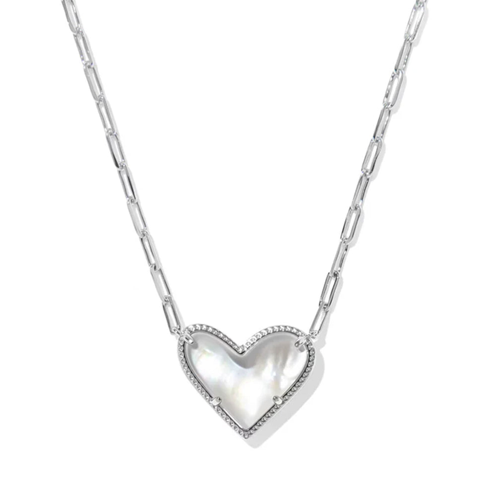 Heart-shaped silver pendant on a chain against a white background