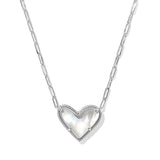 Heart-shaped silver pendant on a chain against a white background