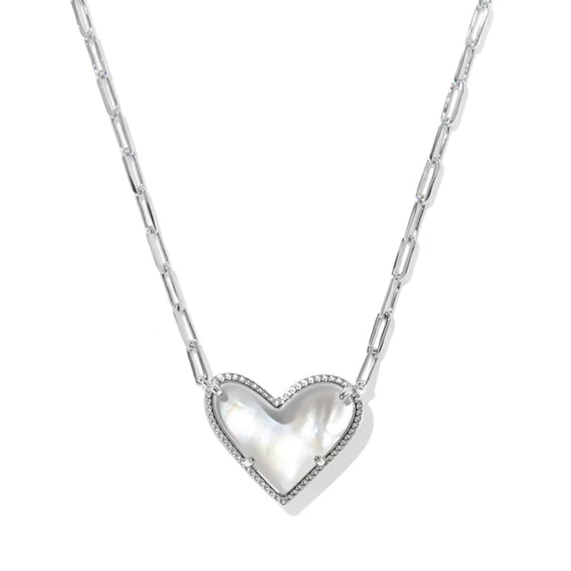 Heart-shaped silver pendant on a chain against a white background