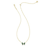 Gold necklace with a green bow pendant on a white background