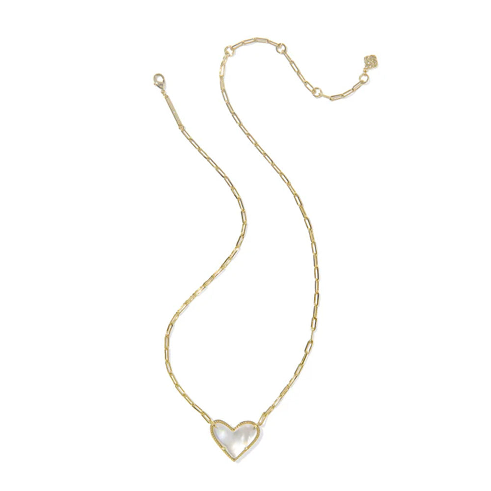 Gold necklace with a heart-shaped pendant on a white background