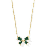 Necklace with green and white pendant on gold chain against a white background