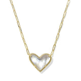 Heart-shaped pendant necklace with gold chain on a white background