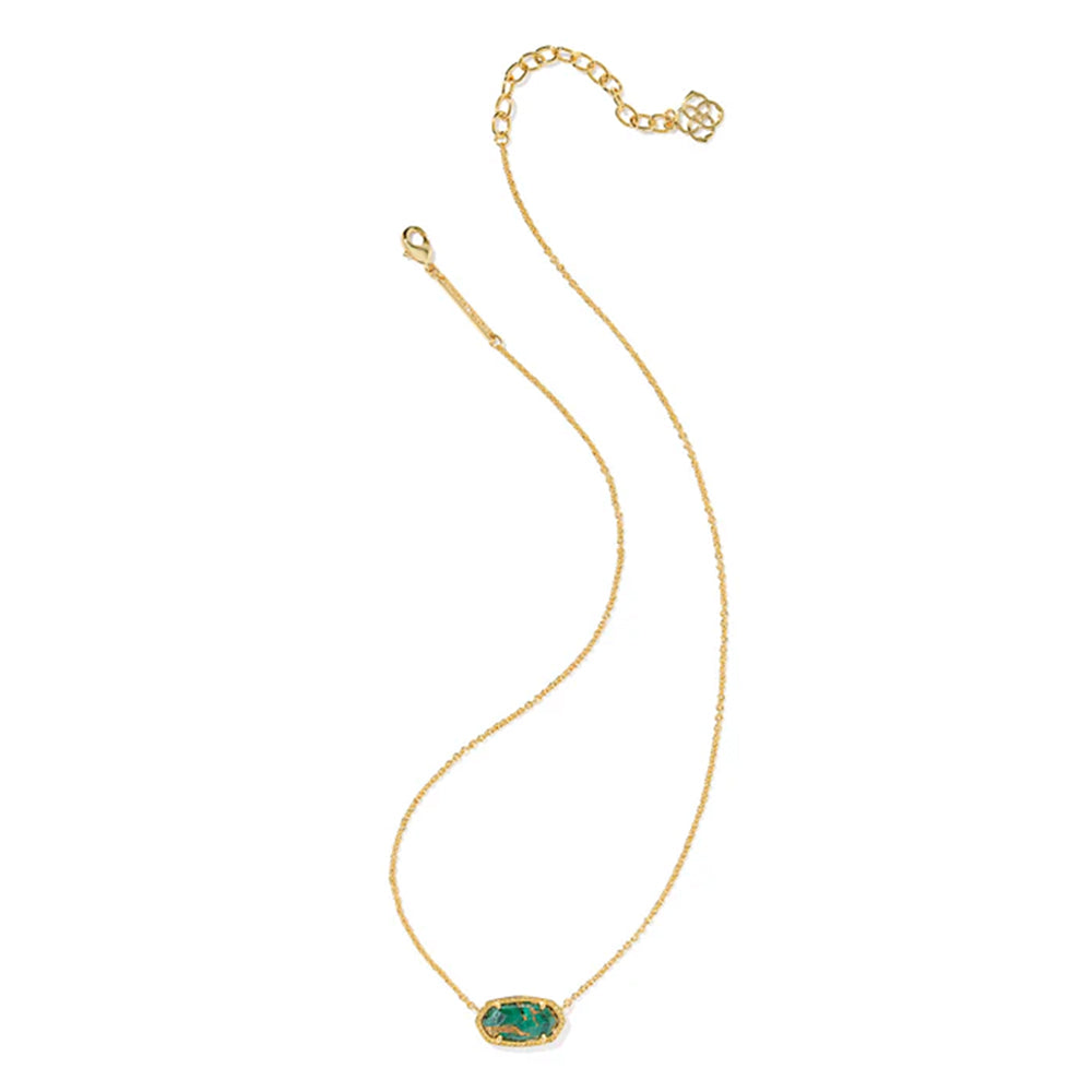 Gold necklace with a green gemstone pendant on a white background