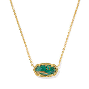 Gold necklace with a green stone pendant on a white background