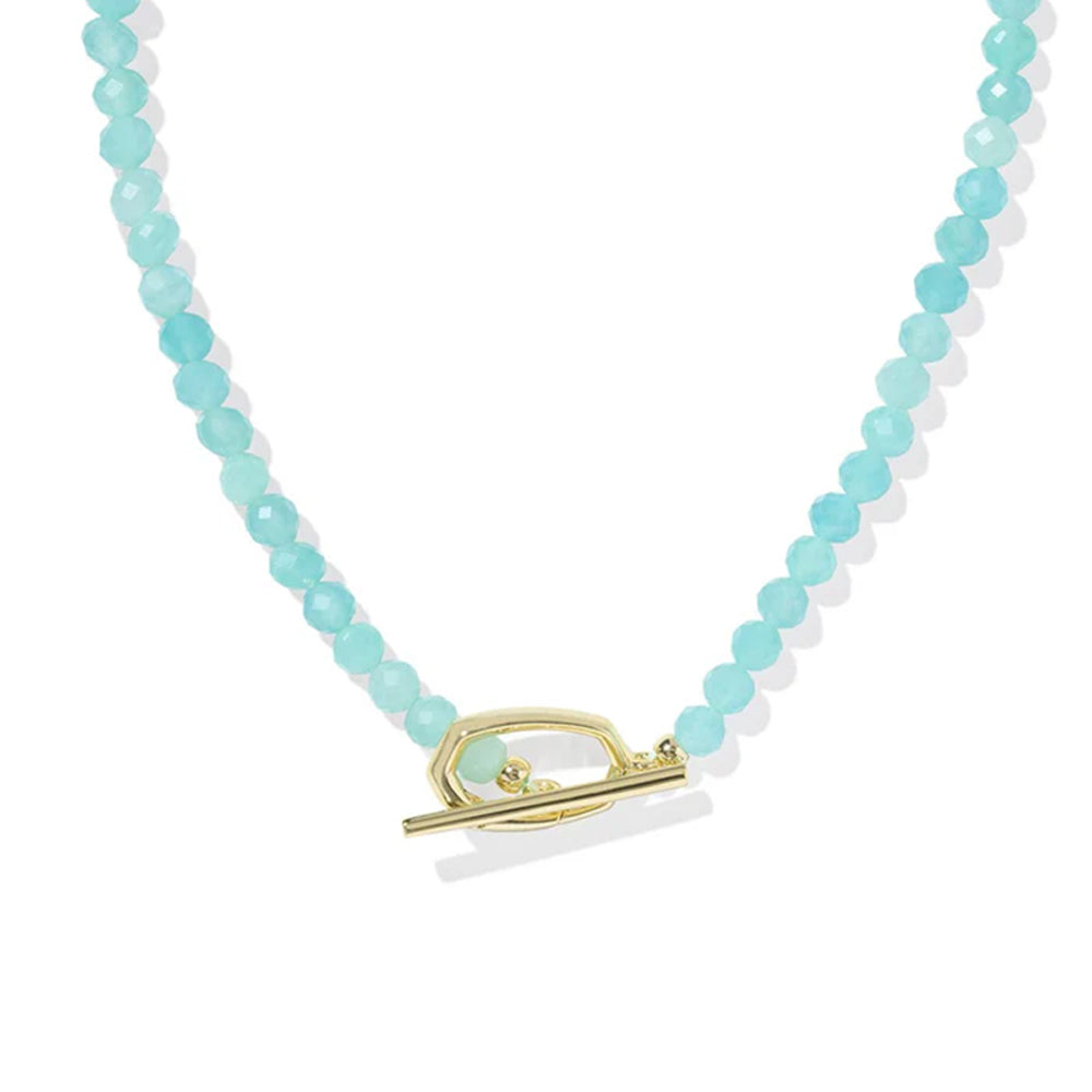 Necklace with turquoise beads and a gold clasp on a white background
