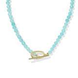 Necklace with turquoise beads and a gold clasp on a white background