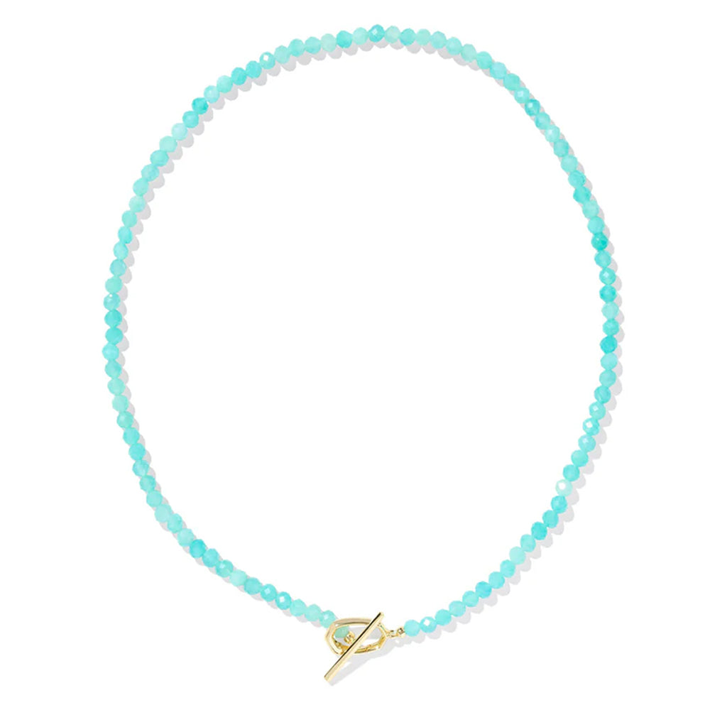 Turquoise beaded necklace with a gold clasp on a white background