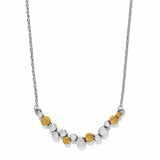 Necklace with alternating gold and silver beads on a white background
