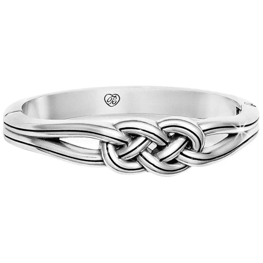 Silver bracelet with a knot design on a white background