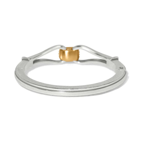 Metallic ring with gold accent on a white background