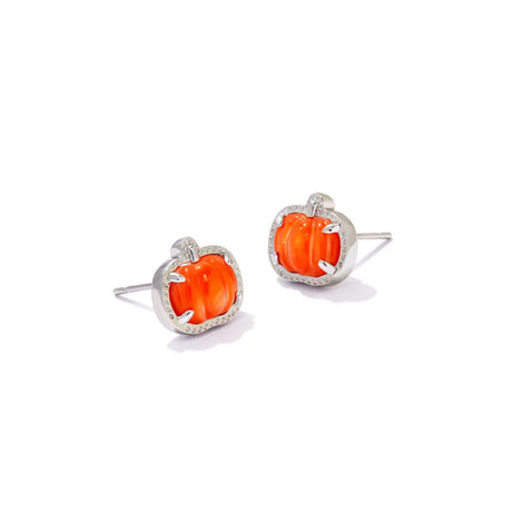 Pair of earrings with orange gemstones and silver frames on a white background