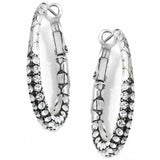 Pair of silver hoop earrings with clear gemstones on a white background