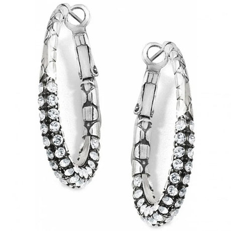 Pair of silver hoop earrings with clear gemstones on a white background