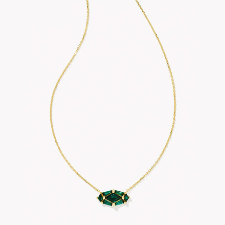 Gold necklace with a green gemstone pendant on a white background