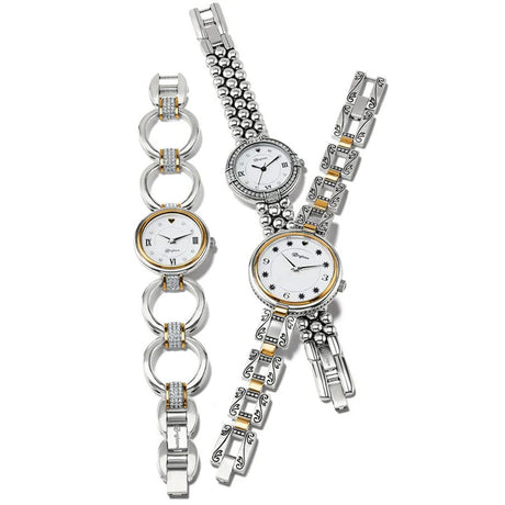 Two silver watches with intricate designs on a white background