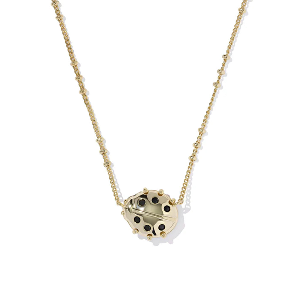Gold necklace with a unique pendant on a white background