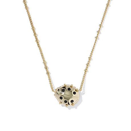 Gold necklace with a unique pendant on a white background