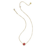 Gold necklace with a red pendant on a white background