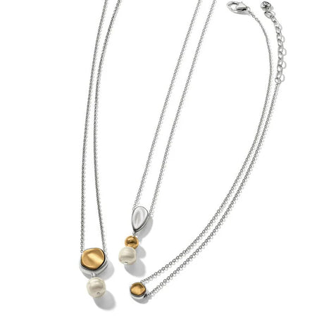 Two necklaces with gold and pearl pendants on a white background