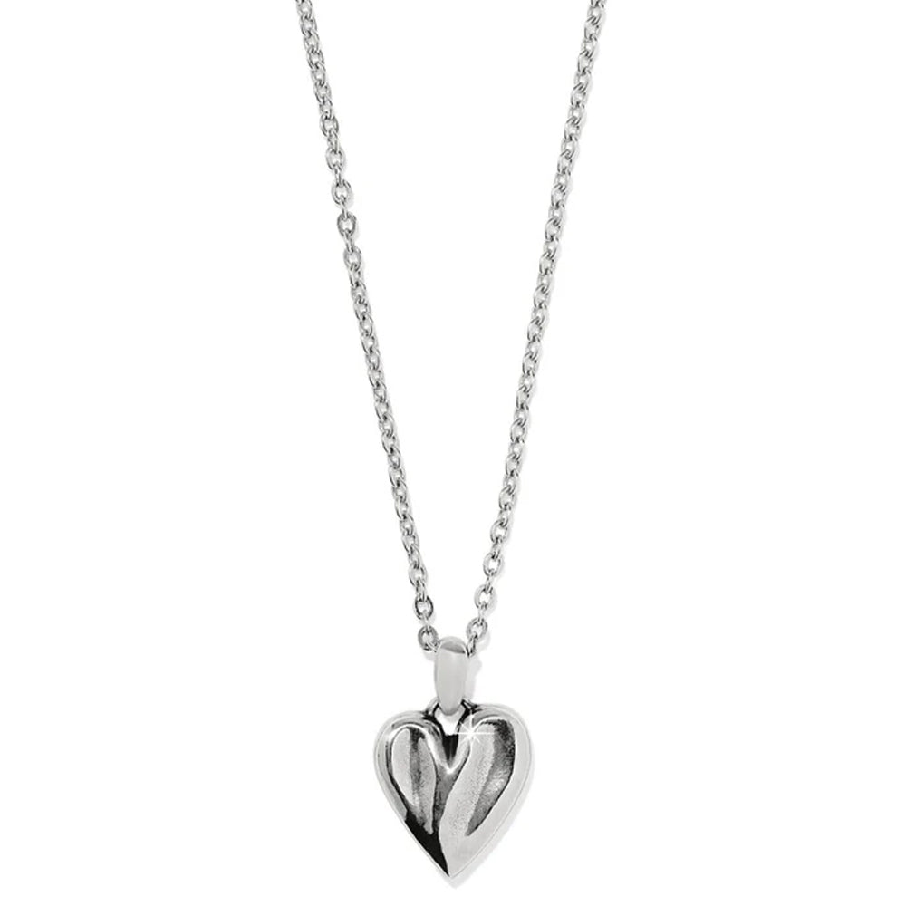 Silver heart-shaped pendant on a chain against a white background