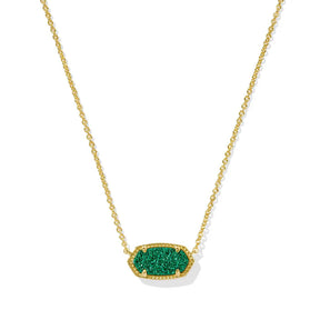 Gold necklace with a green pendant on a white background