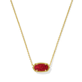 Gold necklace with a red pendant on a white background