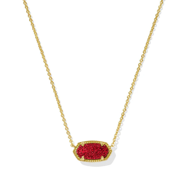 Gold necklace with a red pendant on a white background