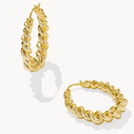 Gold hoop earrings on a white background